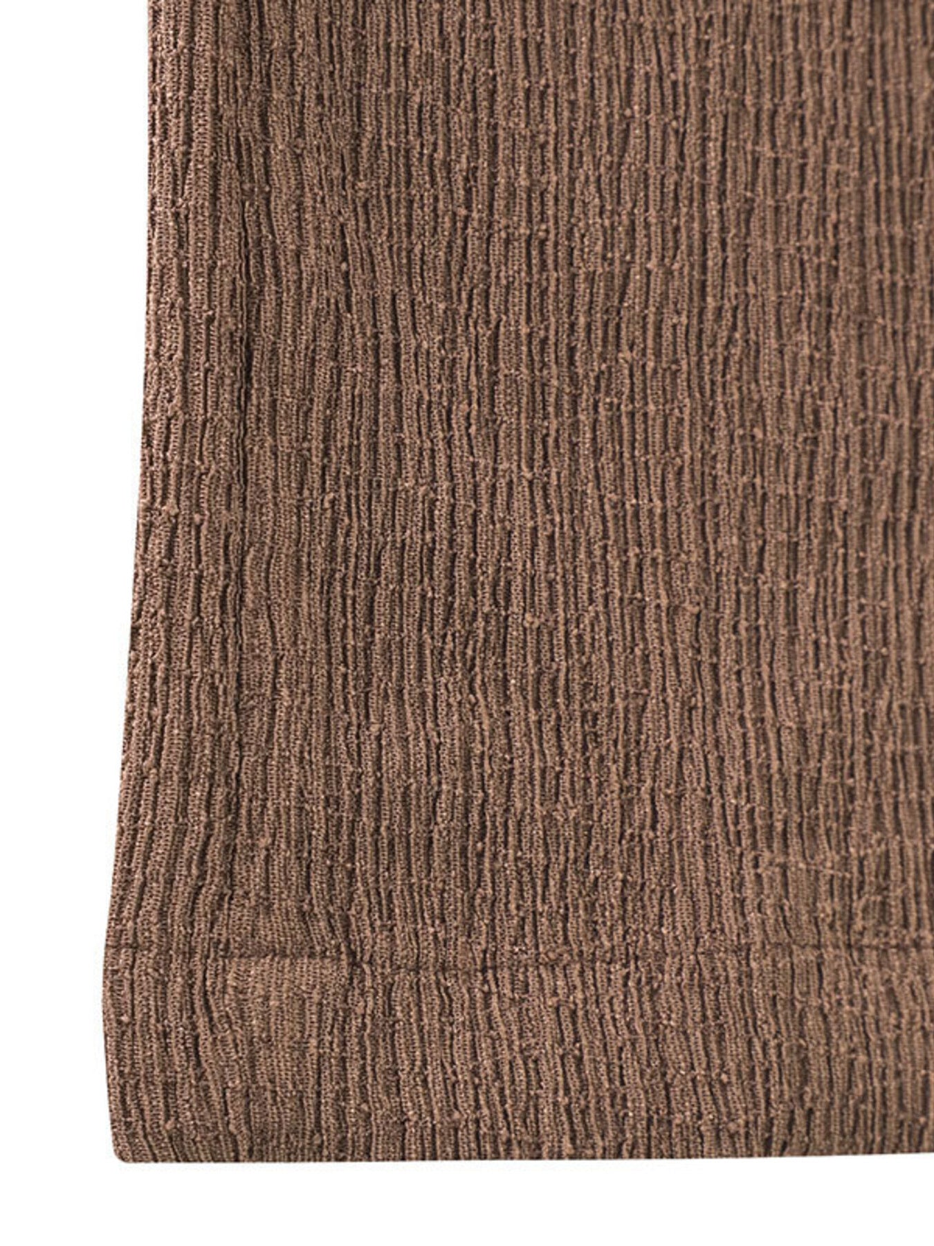 Close-up of a brown textured fabric on a white background