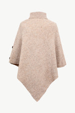 Beige poncho on a white background