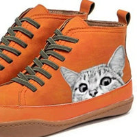 Orange high-top sneakers with a cat design on a white background