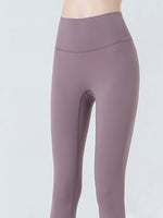 Purple leggings on a plain background