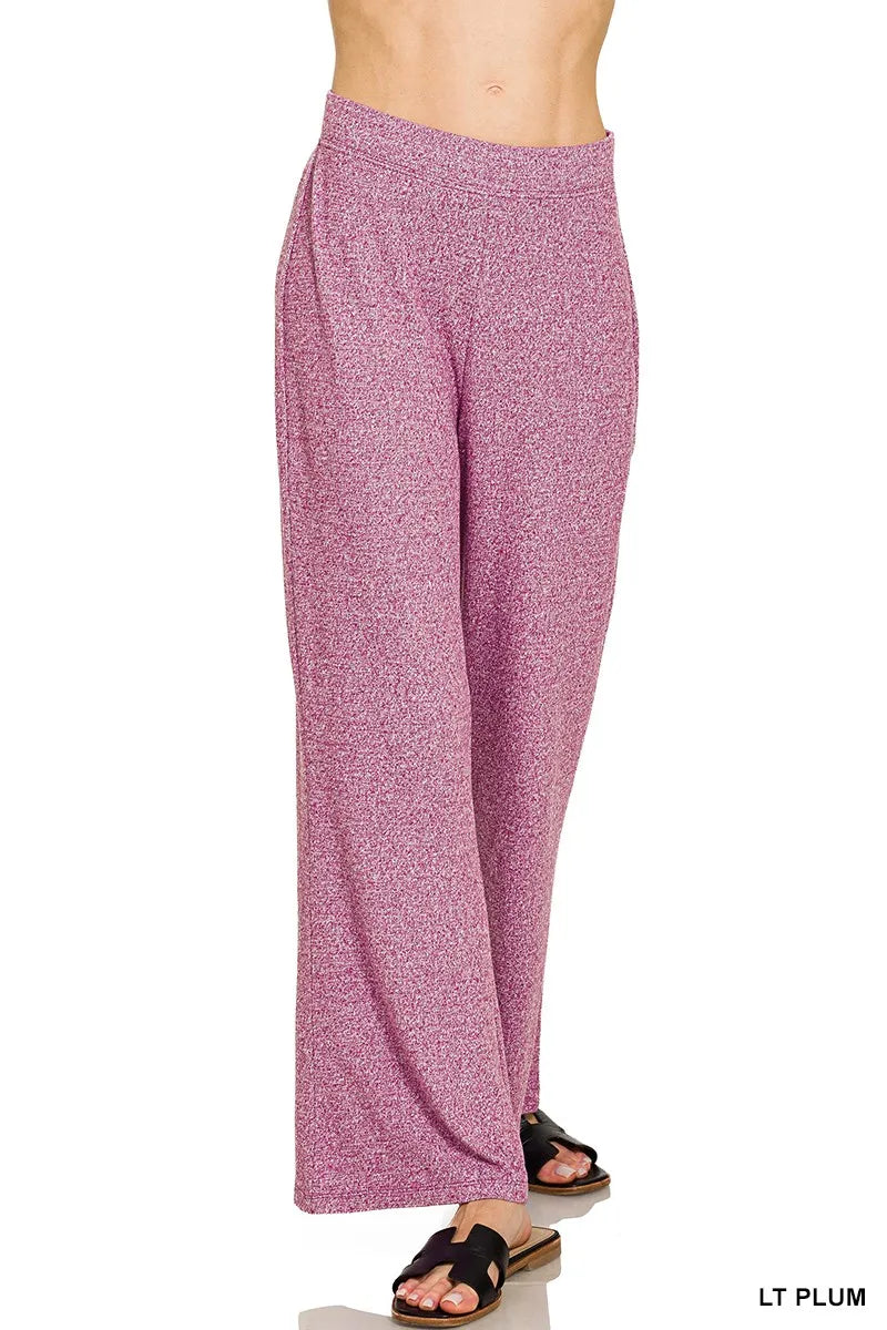 Light plum-colored pants on a white background