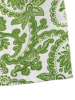Green paisley pattern on a white background