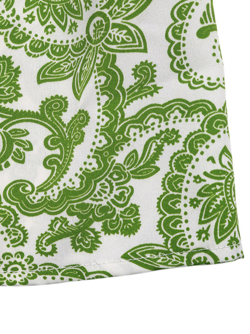 Green paisley pattern on a white background