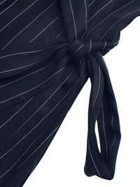 Navy blue pinstripe dress with a knot detail on a white background