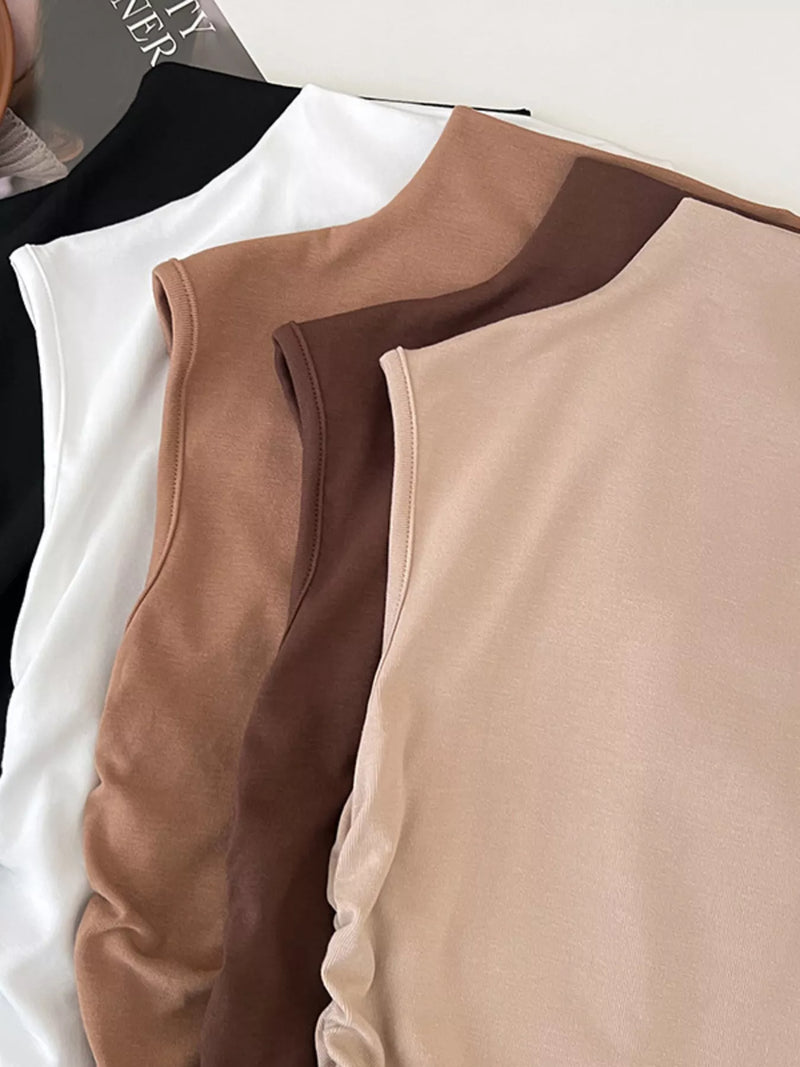 Close-up of a beige and brown sleeveless top on a white background