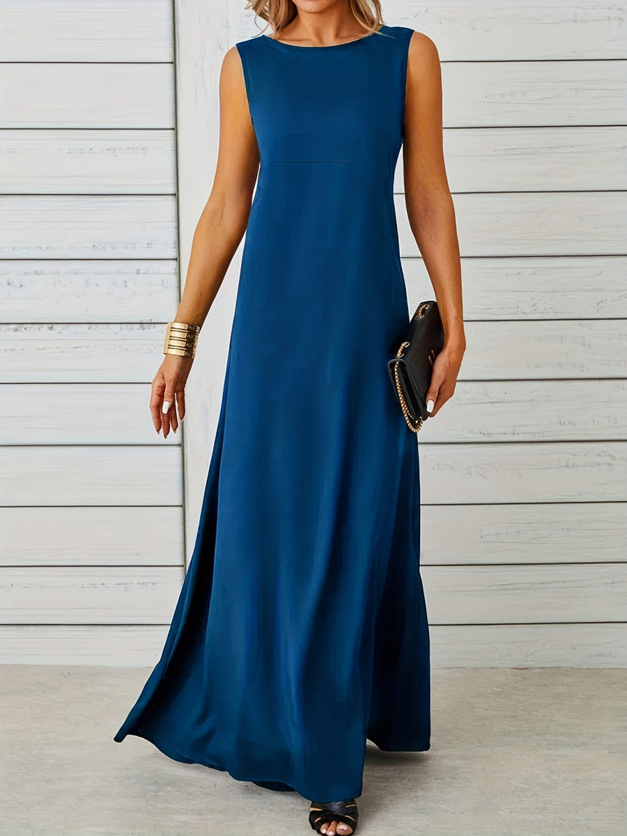 Woman wearing a blue sleeveless dress against a light wooden panel background
