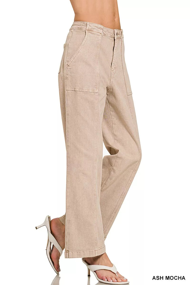 Beige pants worn by a person on a white background