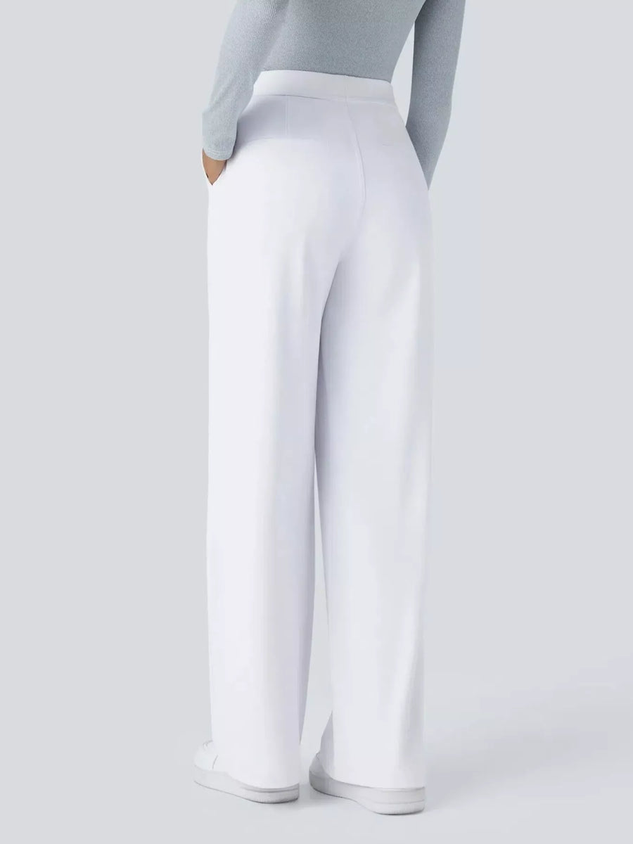 White pants worn by a person on a light gray background