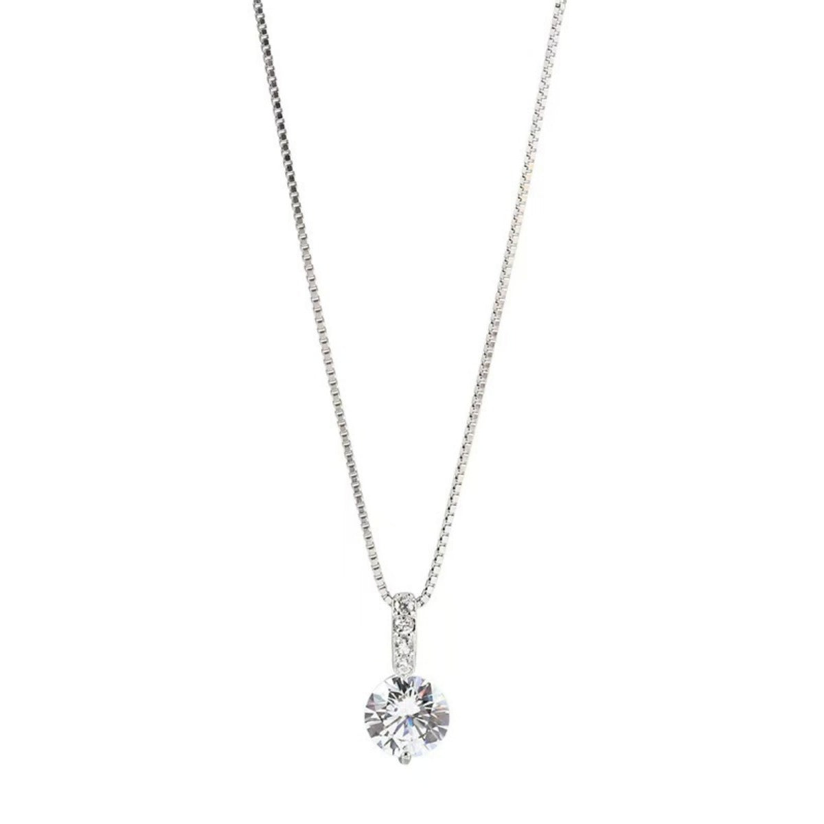 Silver necklace with a round pendant on a white background