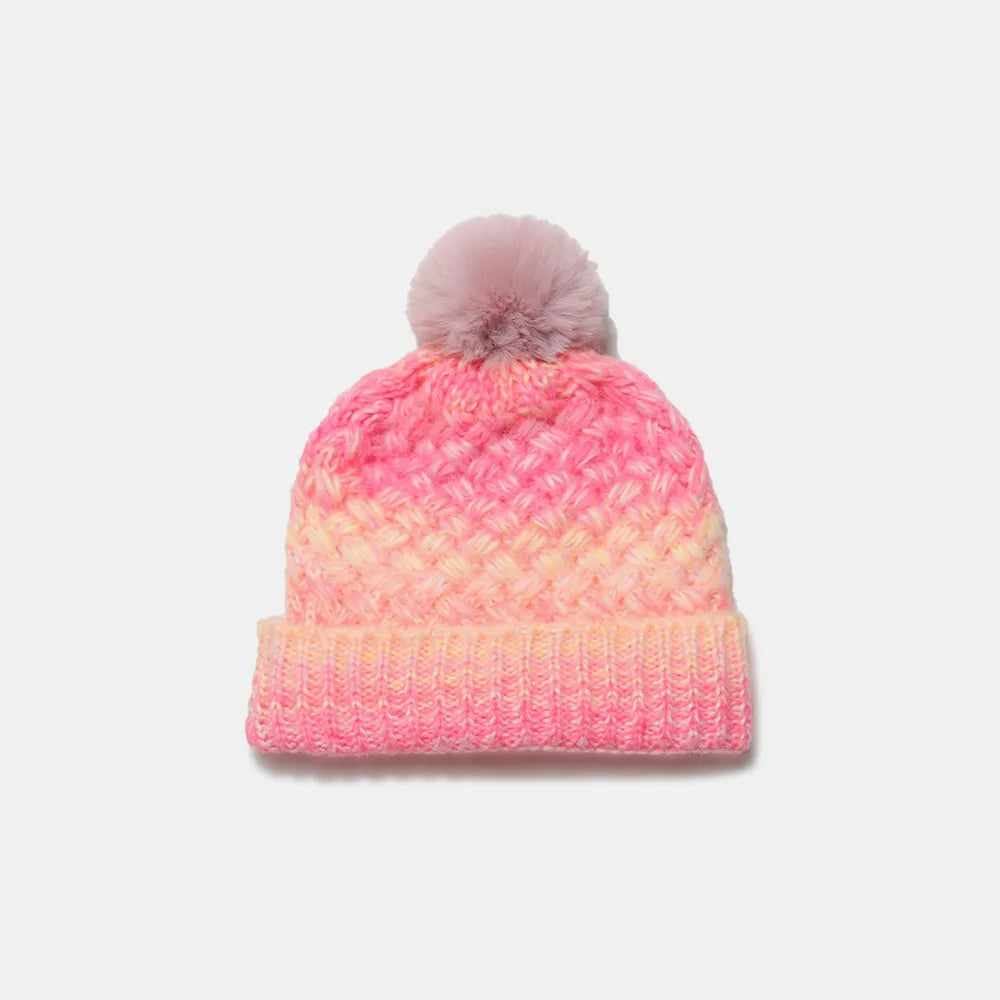 Pink and orange beanie with a pom-pom on a white background
