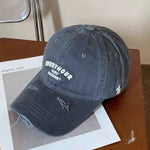 Blue cap with text on a wooden surface