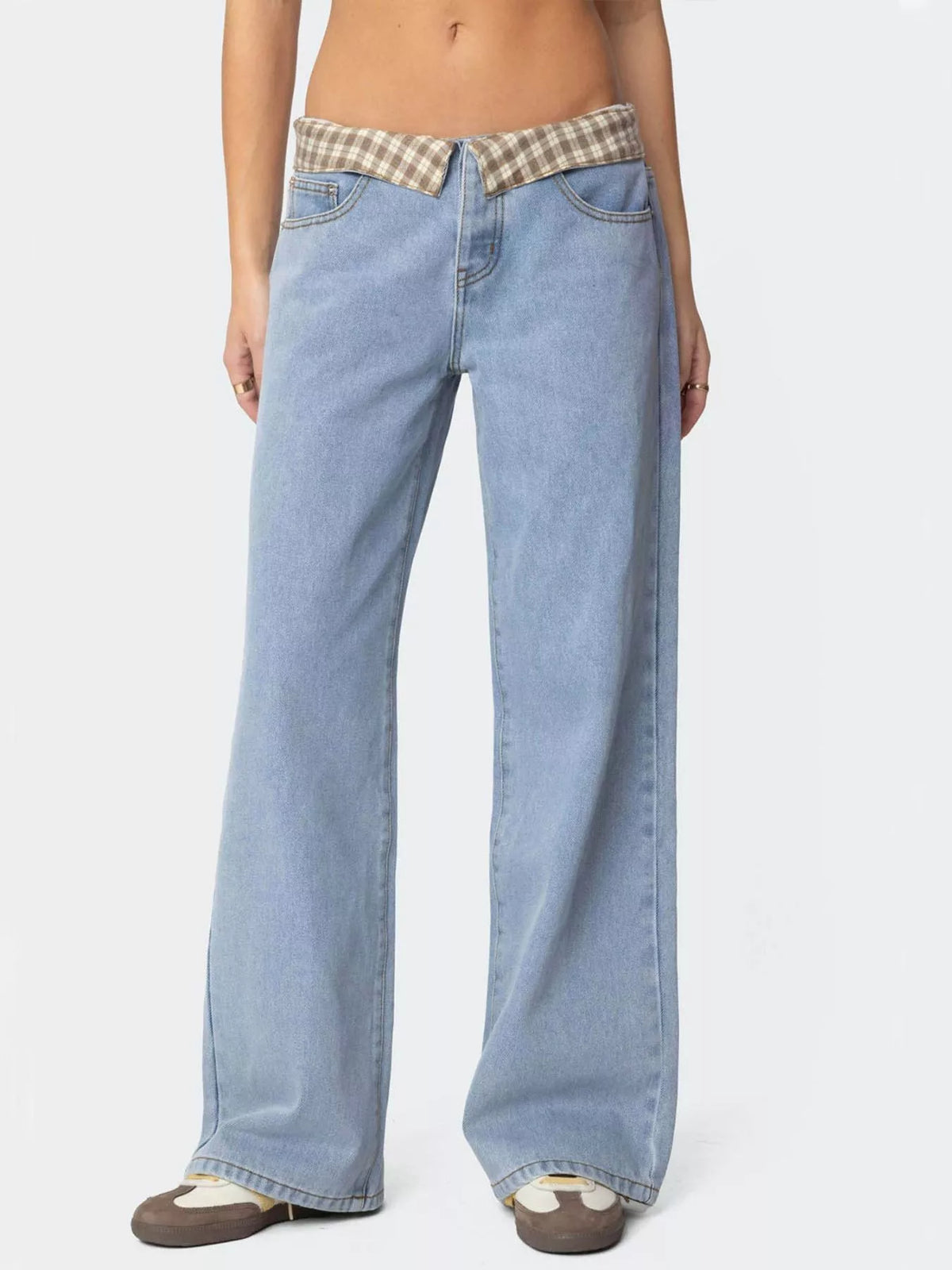 Light blue jeans with a plaid waistband on a white background