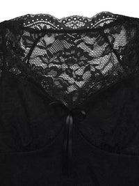 Black lace garment with a close-up of the lace detailing.