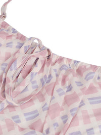 Pink and purple patterned fabric on a white background