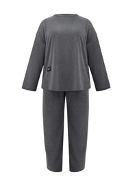 Gray pajama set with a small black logo on a white background