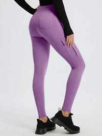 Purple leggings worn by a person on a white background
