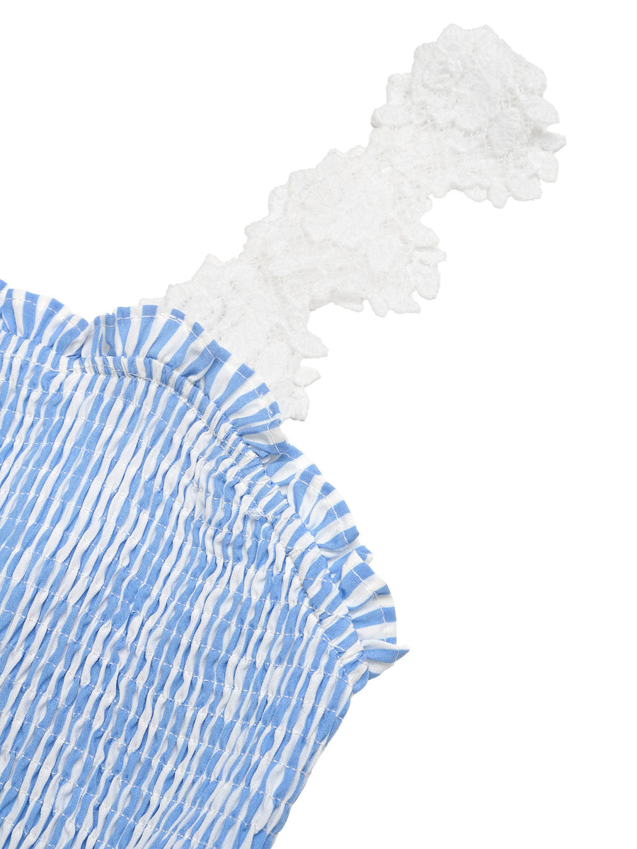 Blue and white patterned fabric with ruffled edge on a white background