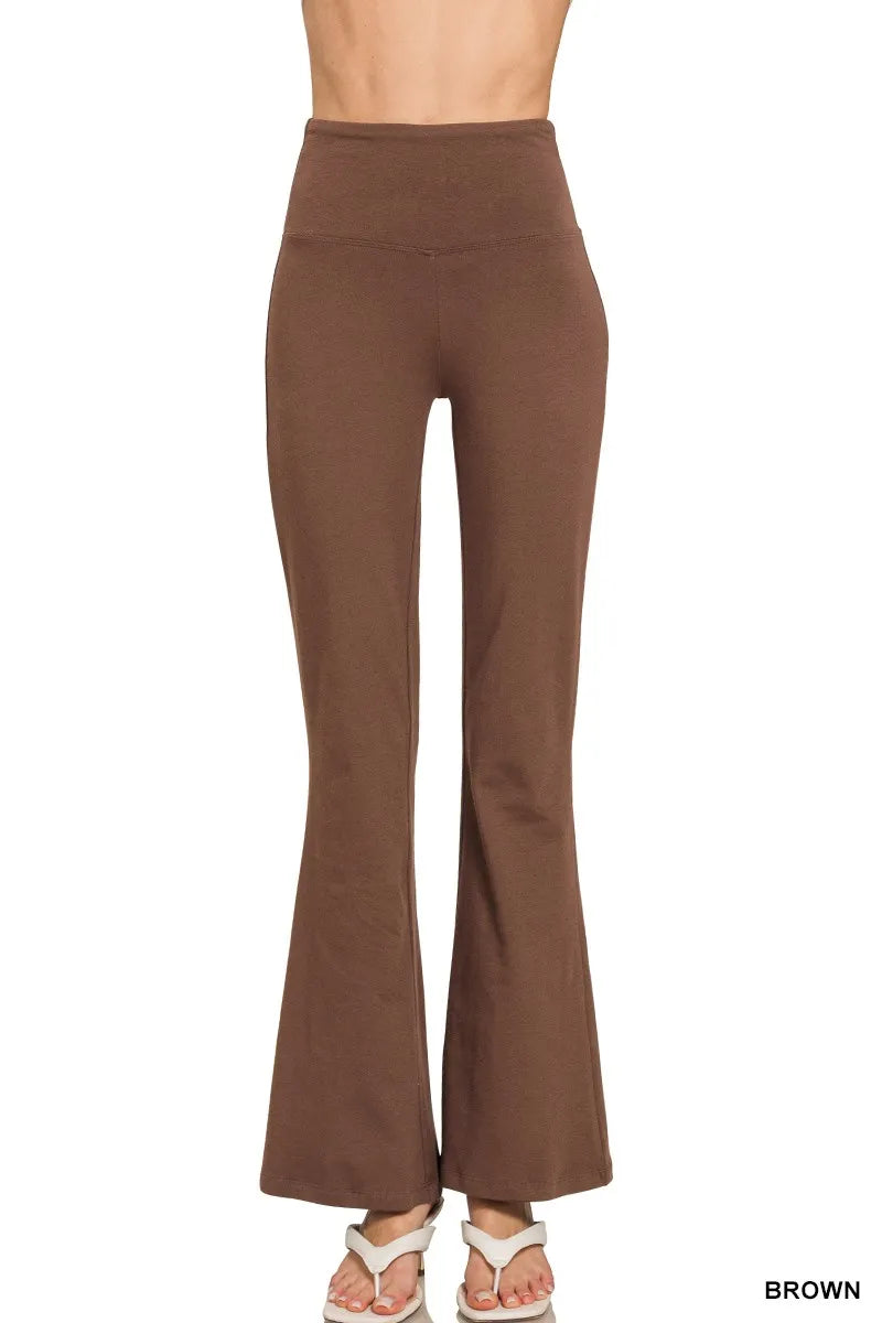 Brown flared pants on a white background