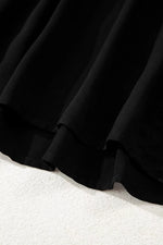 Close-up of a black skirt on a white background