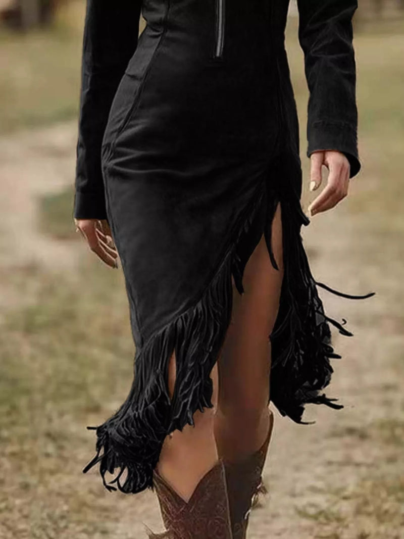 Black fringed dress worn by a person in an outdoor setting