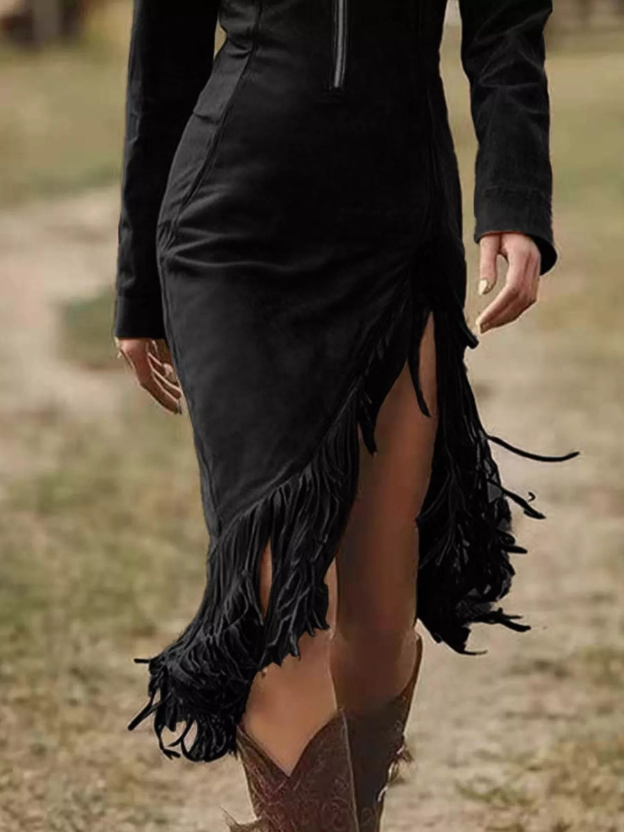 Black fringed dress worn by a person in an outdoor setting