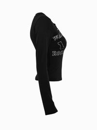 Black long-sleeve crop top with text on a white background