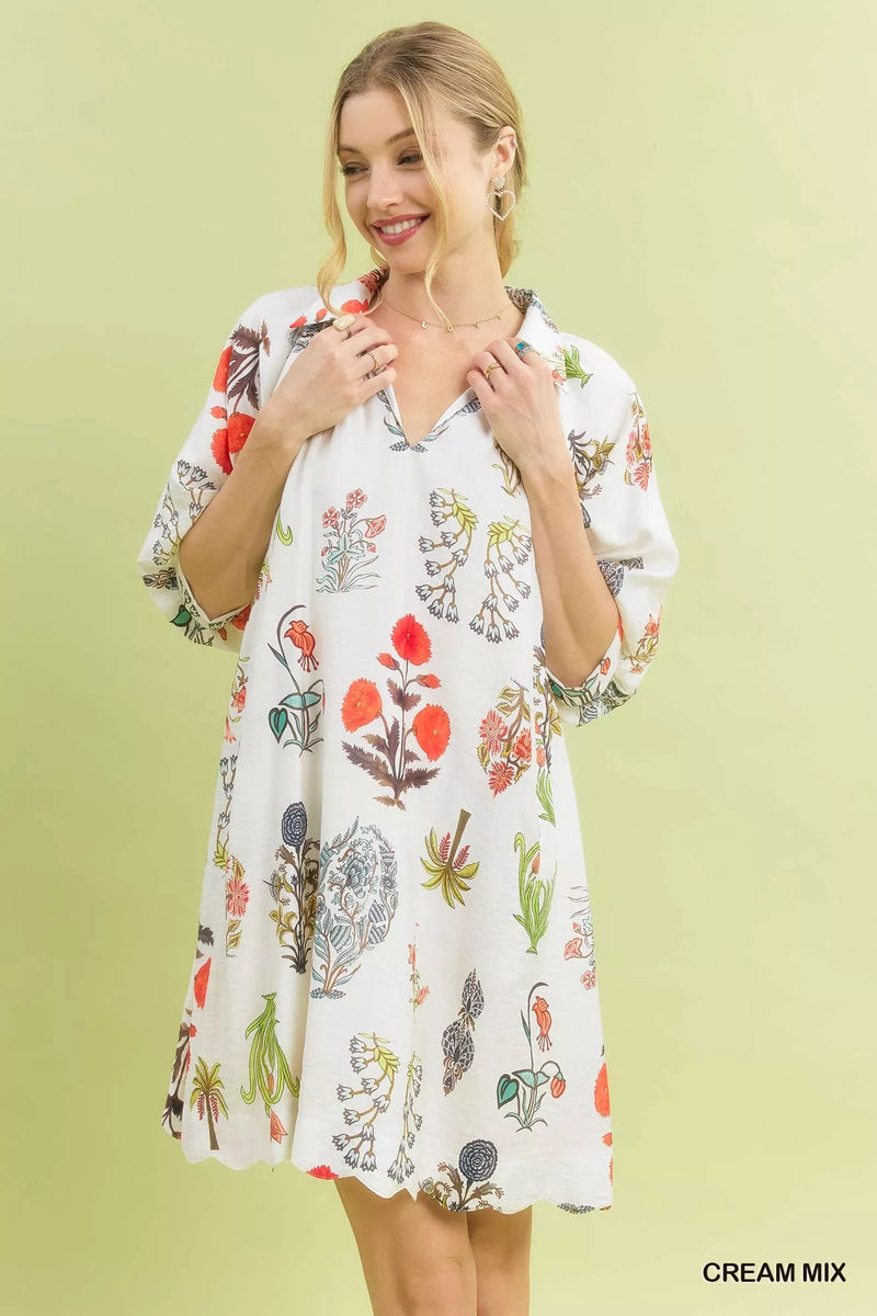 Woman wearing a floral dress against a light green background
