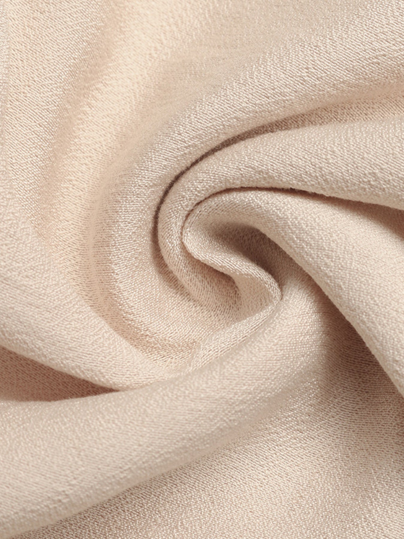 Close-up of beige fabric with a soft texture