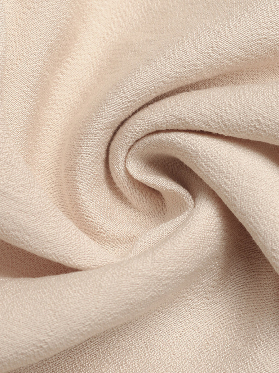 Close-up of beige fabric with a soft texture