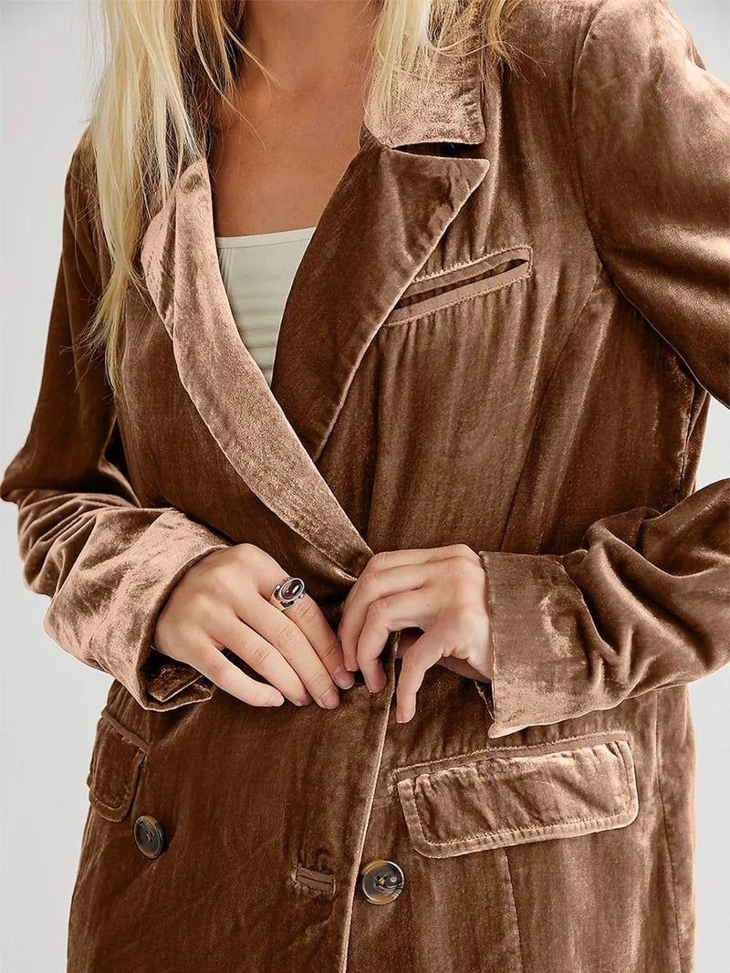 Brown corduroy jacket worn by a person on a plain background