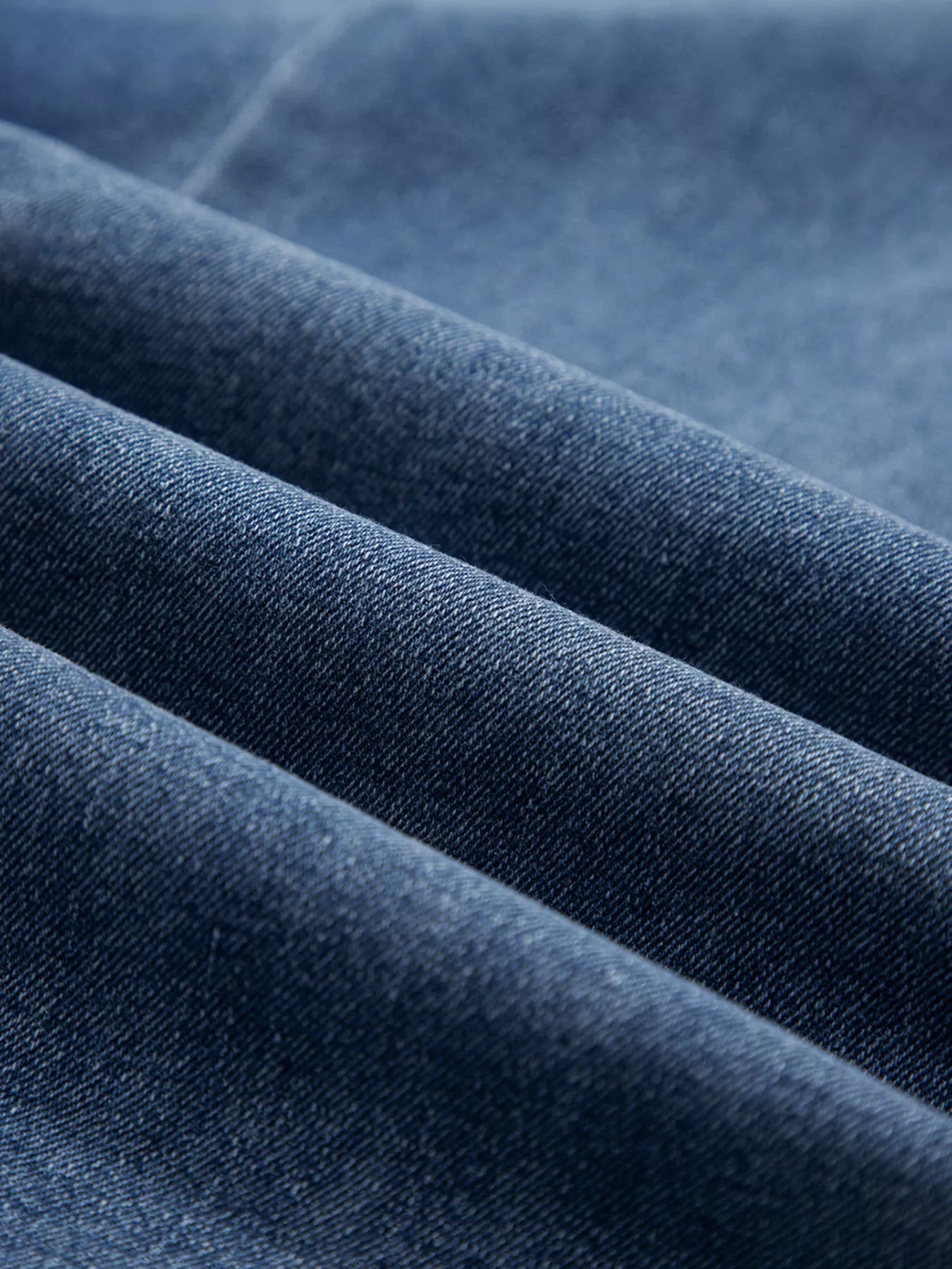 Close-up of blue denim fabric with visible texture