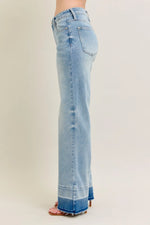 Light blue jeans on a plain background