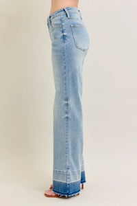 Light blue jeans on a plain background