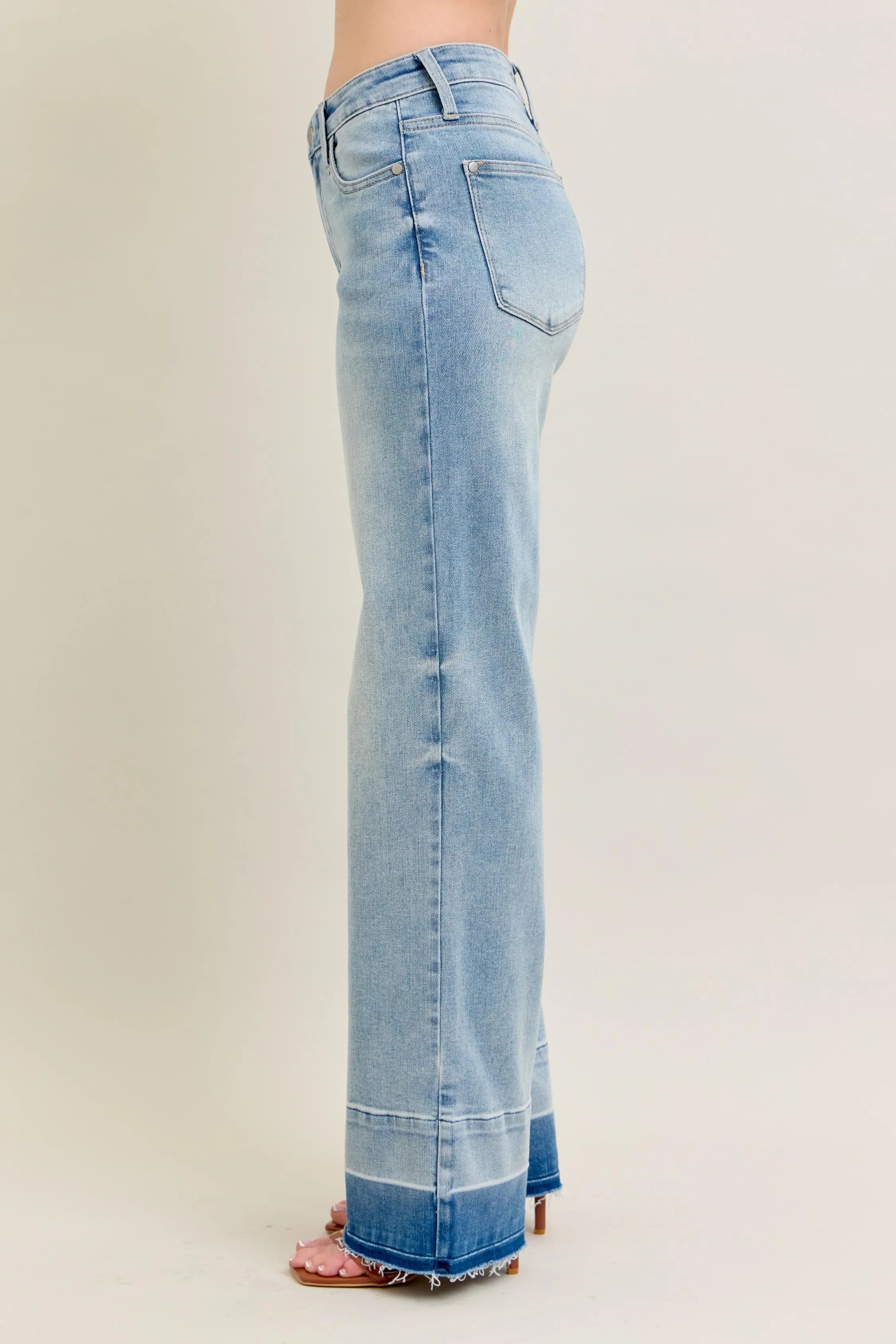 Light blue jeans on a plain background