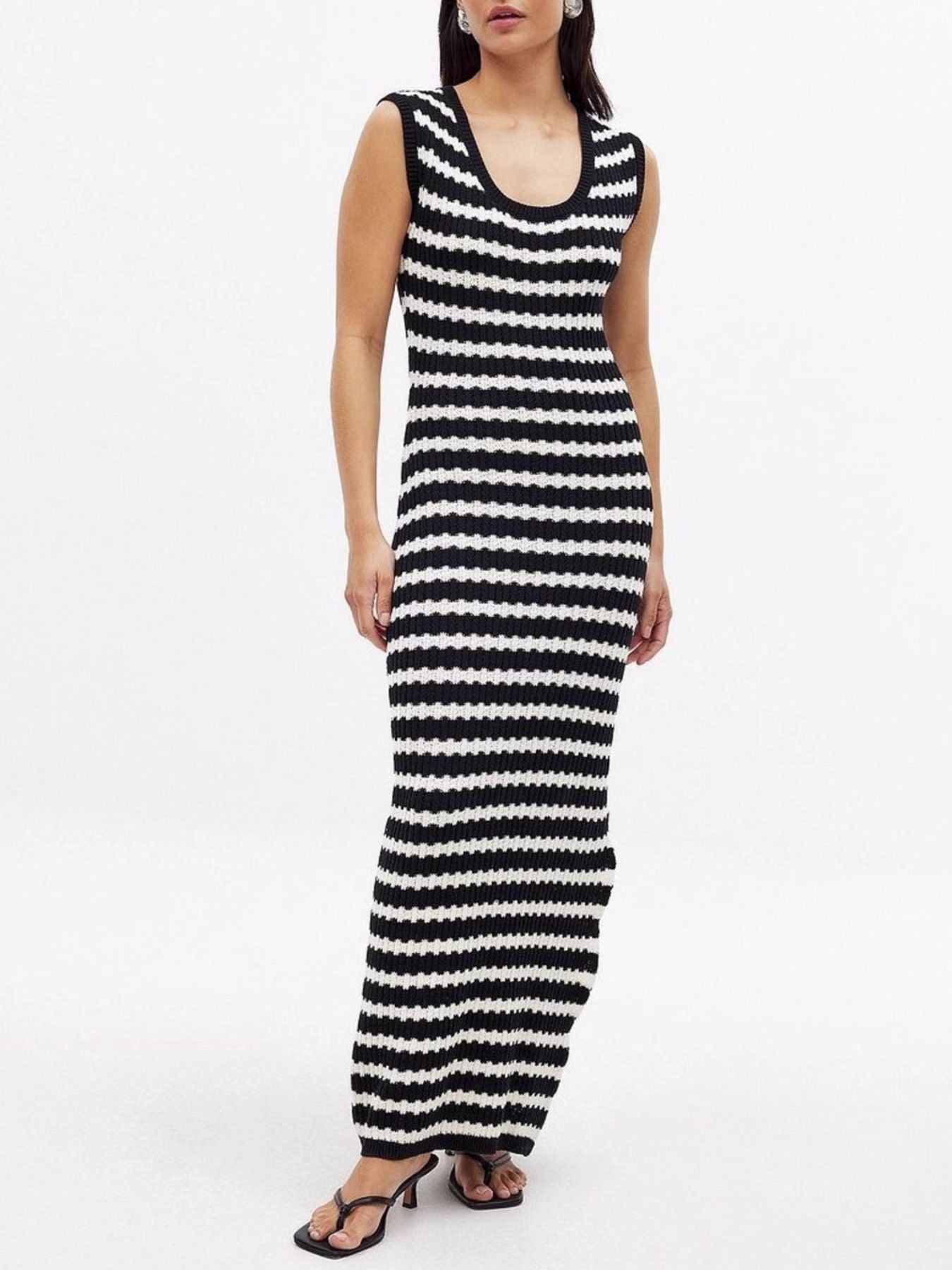 Black and white striped sleeveless dress on a white background