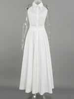 White dress on a mannequin against a gray background