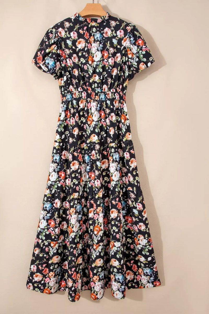 Floral dress on a hanger against a beige background