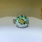 Ring with a large green gemstone on a white surface
