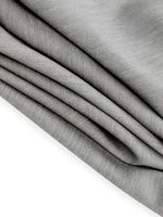 Close-up of gray fabric with a slight texture on a white background