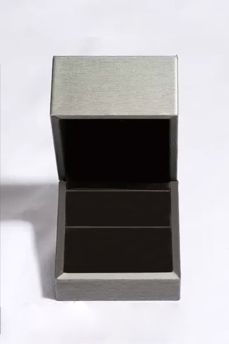 Silver jewelry box with a textured lid on a white background