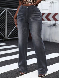 Person wearing gray wide-leg jeans on a zebra crossing