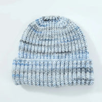 Knitted beanie with blue and gray pattern on a white background