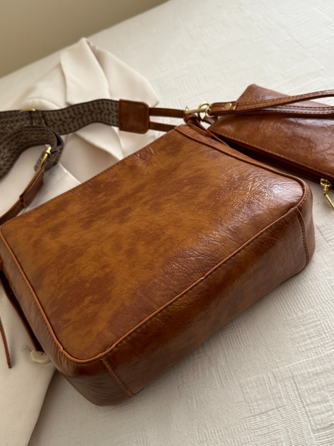 Another side view of brown PU Leather Adjustable Strap Crossbody Bag with Pouch