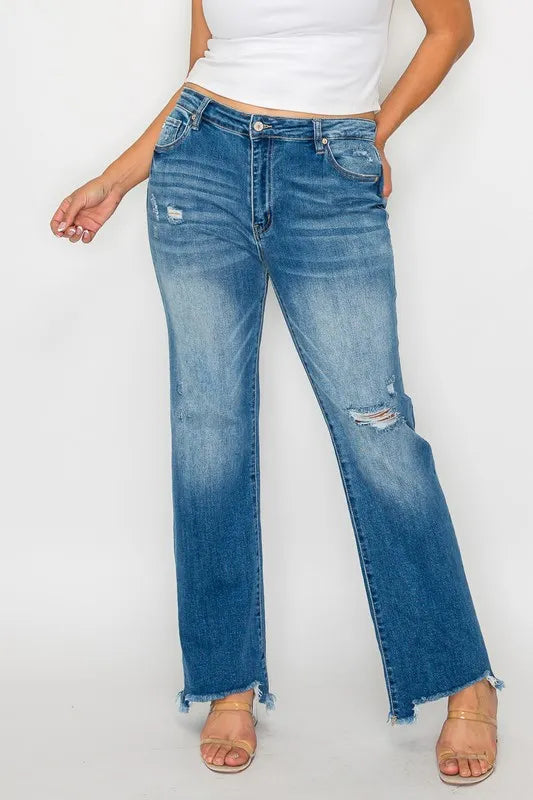 Blue jeans worn by a person on a white background