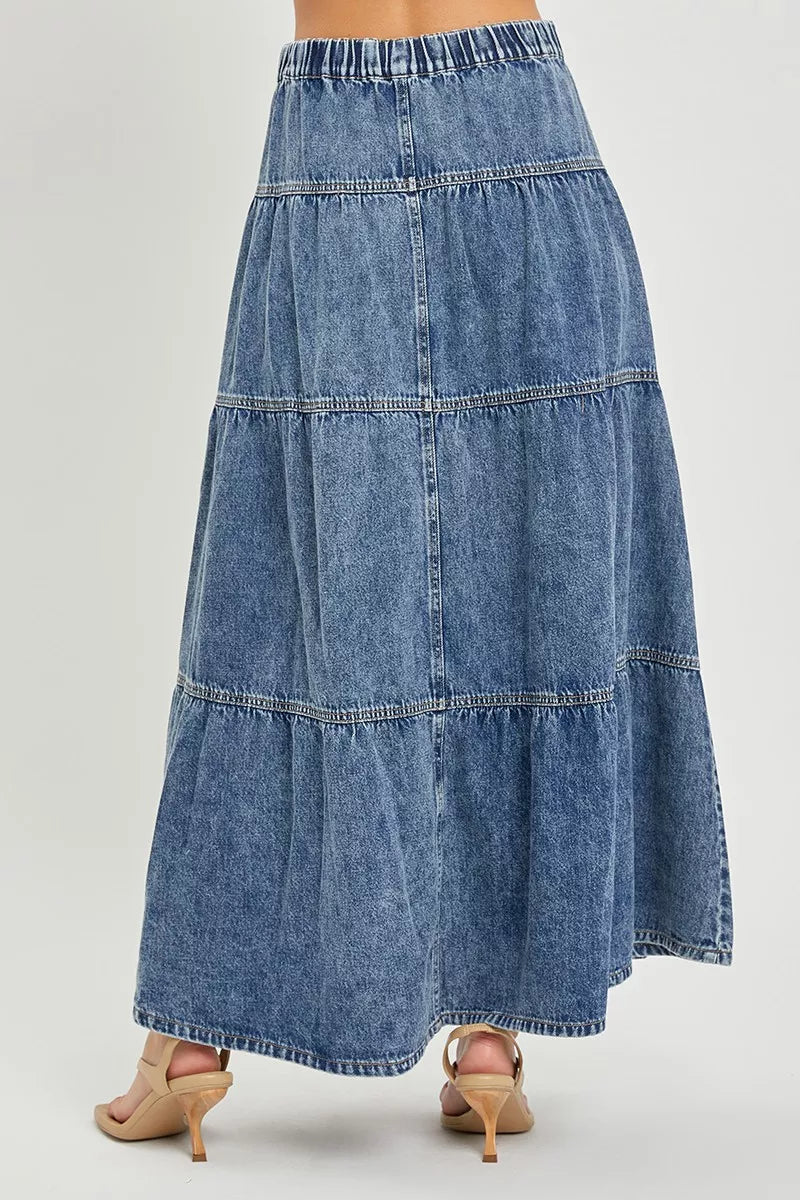 Denim skirt with tiered design on a plain background