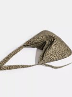 Leopard print headband on a white background