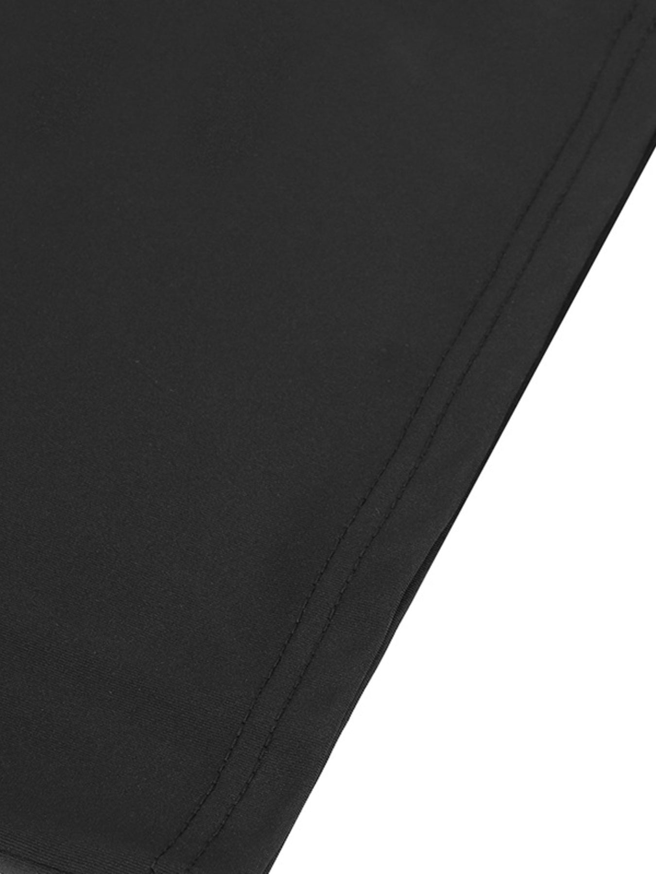 Close-up of a black fabric texture on a white background