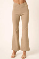 Beige flared pants on a white background
