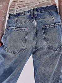 Close-up of blue jeans with a plain background