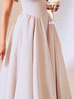 Beige dress with a plain background